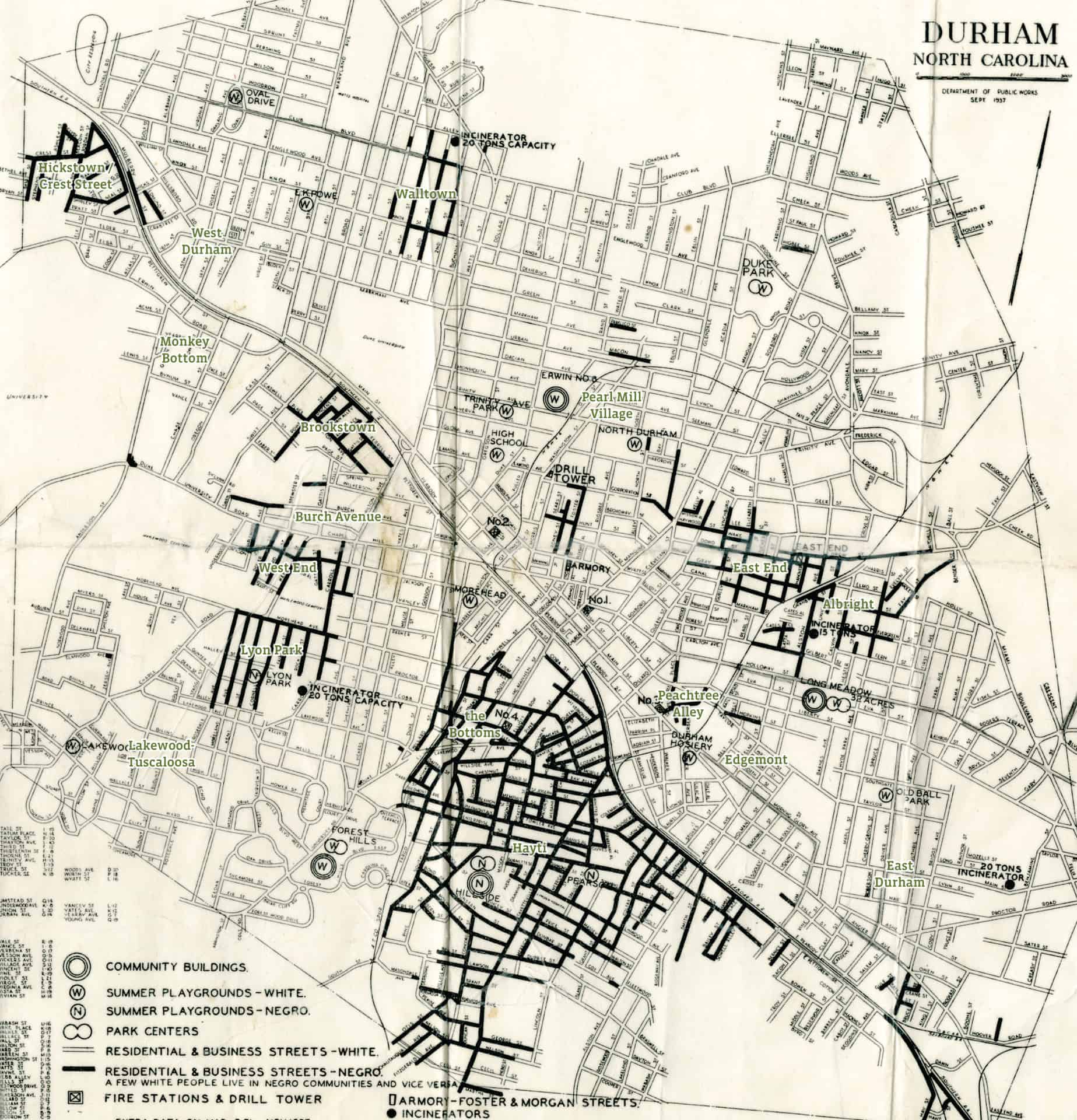 Copy of a 1930s era city planning map of Durham on which city officials have highlighted blocks where Black residents live.